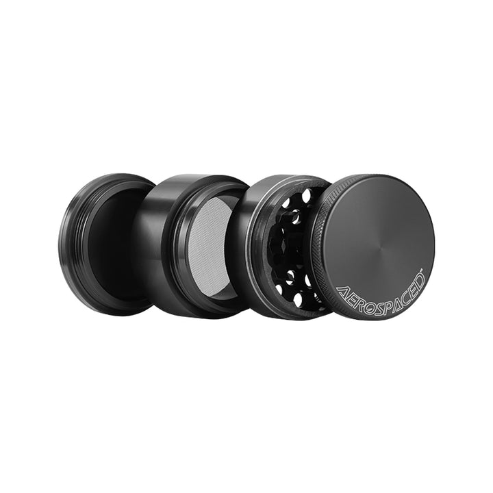 Open black 4 piece Aerospaced grinder against a white background.